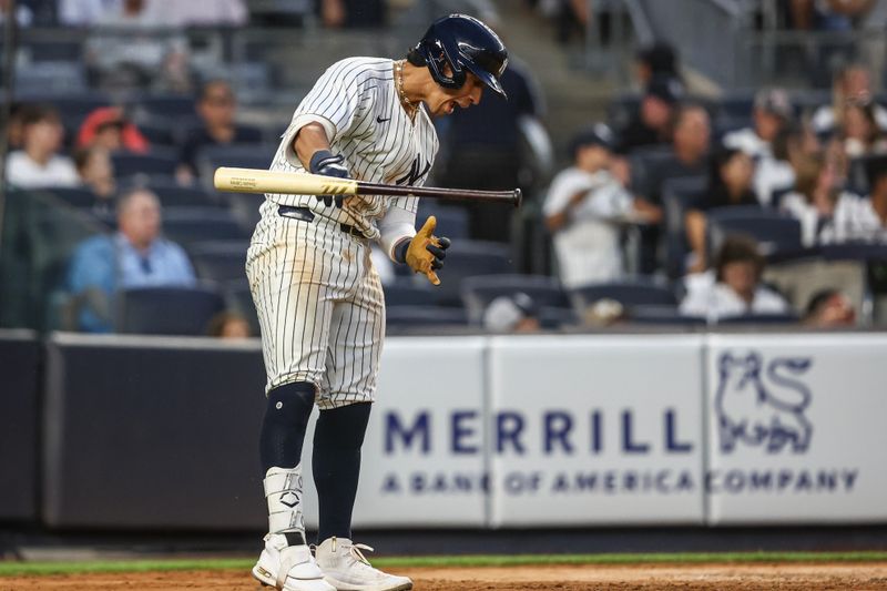 Jun 22, 2024; Bronx, New York, USA;  New York Yankees third baseman Oswaldo Cabrera (95) reacts after popping out to end the fourth inning against the Atlanta Braves at Yankee Stadium. Mandatory Credit: Wendell Cruz-USA TODAY Sports