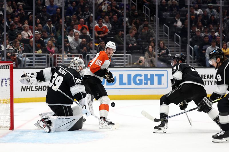 Nov 11, 2023; Los Angeles, California, USA;  Philadelphia Flyers left wing Joel Farabee (86) watches the puck as Los Angeles Kings goaltender Cam Talbot (39) defends the goal during the third period at Crypto.com Arena. Mandatory Credit: Kiyoshi Mio-USA TODAY Sports