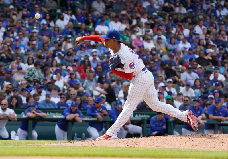 Aug 19, 2023; Chicago, Illinois, USA; Chicago Cubs relief pitcher Adbert Alzolay (73) throws the ball against the Kansas City Royals during the ninth inning at Wrigley Field. Mandatory Credit: David Banks-USA TODAY Sports