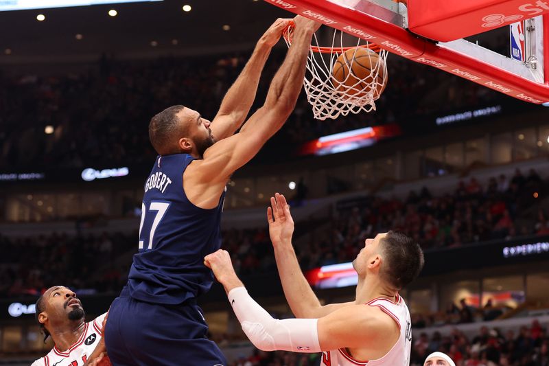 CHICAGO, ILLINOIS - FEBRUARY 06: Rudy Gobert #27 of the Minnesota Timberwolves dunks against the Chicago Bulls during the first half at the United Center on February 06, 2024 in Chicago, Illinois. NOTE TO USER: User expressly acknowledges and agrees that, by downloading and or using this photograph, User is consenting to the terms and conditions of the Getty Images License Agreement.  (Photo by Michael Reaves/Getty Images)