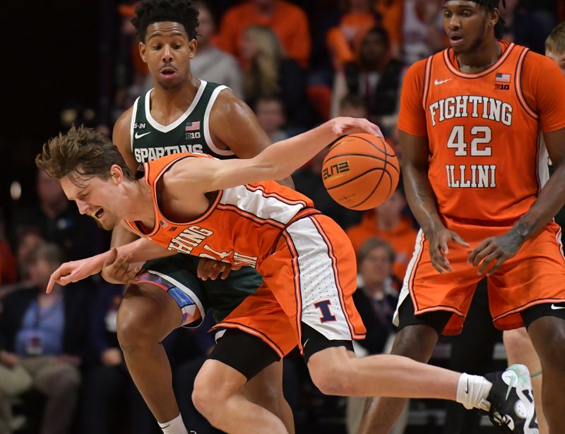 Jan 13, 2023; Champaign, Illinois, USA; Illinois Fighting Illini forward Matthew Mayer (24) controls the ball as Michigan State Spartans guard A.J. Hoggard (11) pressures during the second half at State Farm Center. Mandatory Credit: Ron Johnson-USA TODAY Sports