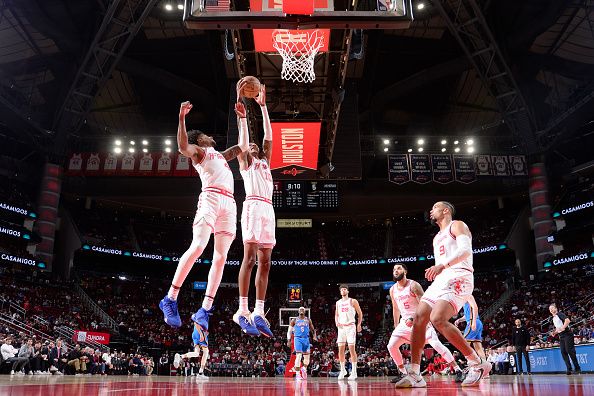 HOUSTON, TX - DECEMBER 6:   Jabari Smith Jr. #10 of the Houston Rockets grabs a rebound during the game against the Oklahoma City Thunder on December 6, 2023 at the Toyota Center in Houston, Texas. NOTE TO USER: User expressly acknowledges and agrees that, by downloading and or using this photograph, User is consenting to the terms and conditions of the Getty Images License Agreement. Mandatory Copyright Notice: Copyright 2023 NBAE (Photo by Michael Gonzales/NBAE via Getty Images)