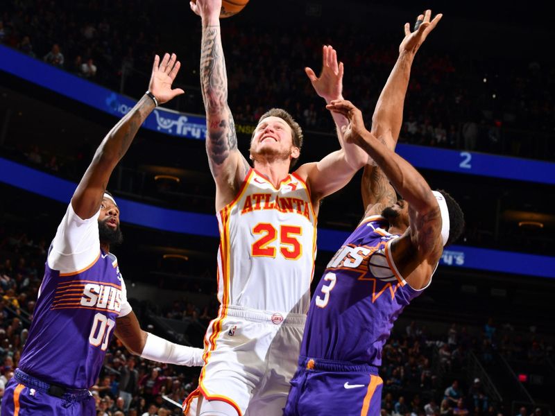 PHOENIX, AZ - MARCH 21:  Garrison Mathews #25 of the Atlanta Hawks goes to the basket during the game on March 21, 2024 at Footprint Center in Phoenix, Arizona. NOTE TO USER: User expressly acknowledges and agrees that, by downloading and or using this photograph, user is consenting to the terms and conditions of the Getty Images License Agreement. Mandatory Copyright Notice: Copyright 2024 NBAE (Photo by Barry Gossage/NBAE via Getty Images)