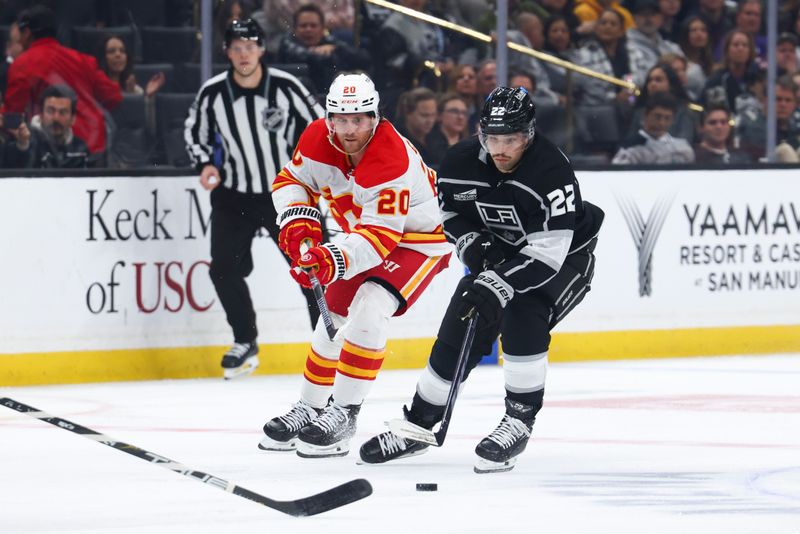 Dec 23, 2023; Los Angeles, California, USA; Los Angeles Kings left wing Kevin Fiala (22) skates with the puck against the Calgary Flames during the second period at Crypto.com Arena. Mandatory Credit: Jessica Alcheh-USA TODAY Sports