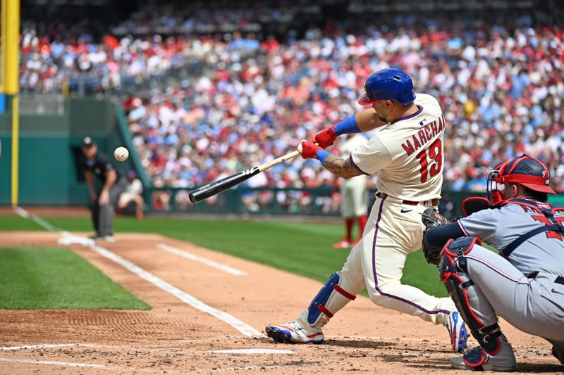 Aug 24, 2025; Philadelphia, Pennsylvania, USA; Philadelphia Phillies catcher Rafael Marchán (13) hits a 2-run RBI during the second inning against the Washington Nationals at Citizens Bank Park. Mandatory Credit: Eric Hartline-Imagn Images
