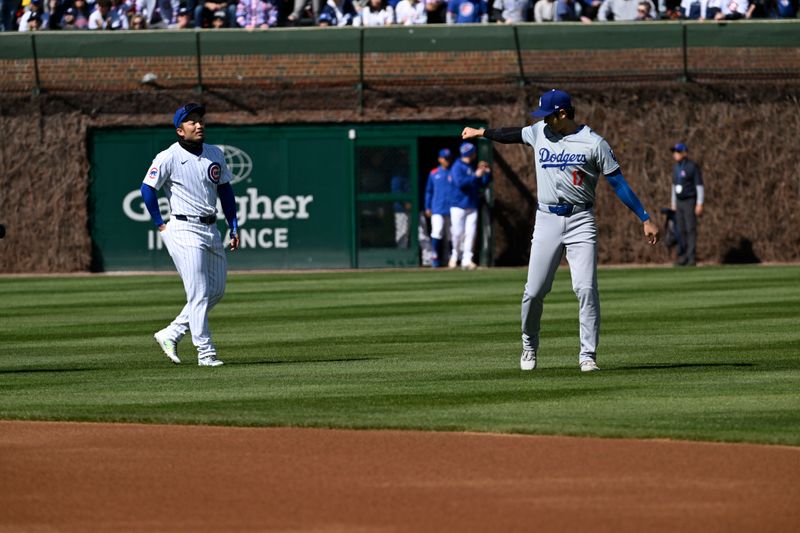 Apr 6, 2024; Chicago, Illinois, USA;  Chicago Cubs outfielder Seiya Suzuki (27) and Los Angeles Dodgers two-way player Shohei Ohtani (17) talk before their teams game at Wrigley Field. Mandatory Credit: Matt Marton-USA TODAY Sports