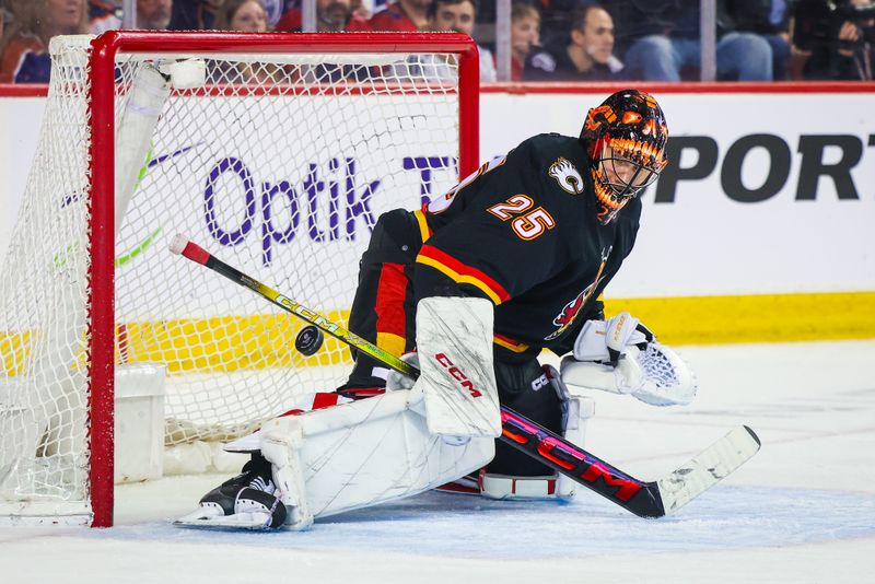 Apr 6, 2024; Calgary, Alberta, CAN; Calgary Flames goaltender Jacob Markstrom (25) makes a save against the Edmonton Oilers during the third period at Scotiabank Saddledome. Mandatory Credit: Sergei Belski-USA TODAY Sports