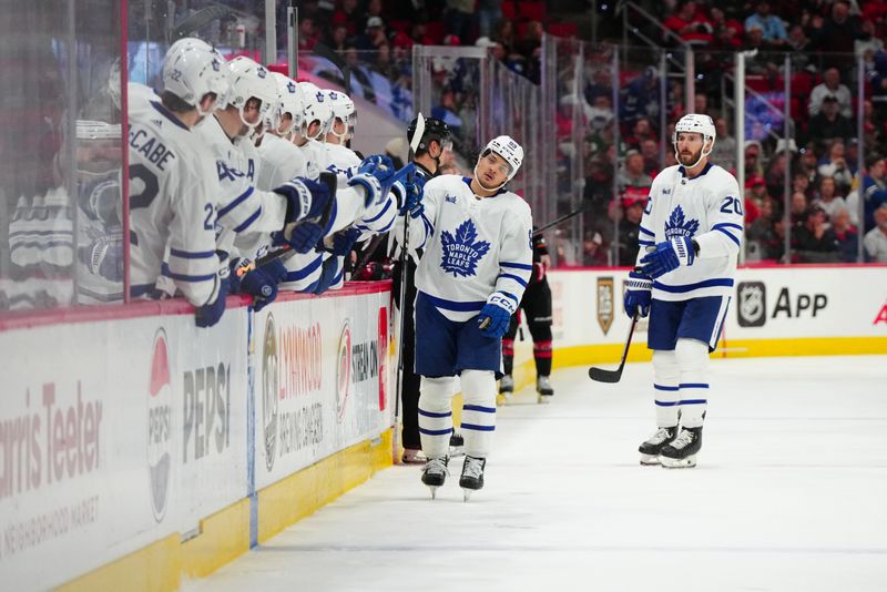 Mar 24, 2024; Raleigh, North Carolina, USA;  Toronto Maple Leafs left wing Nicholas Robertson (89) celebrates his goal against the Carolina Hurricanes during the third period at PNC Arena. Mandatory Credit: James Guillory-USA TODAY Sports