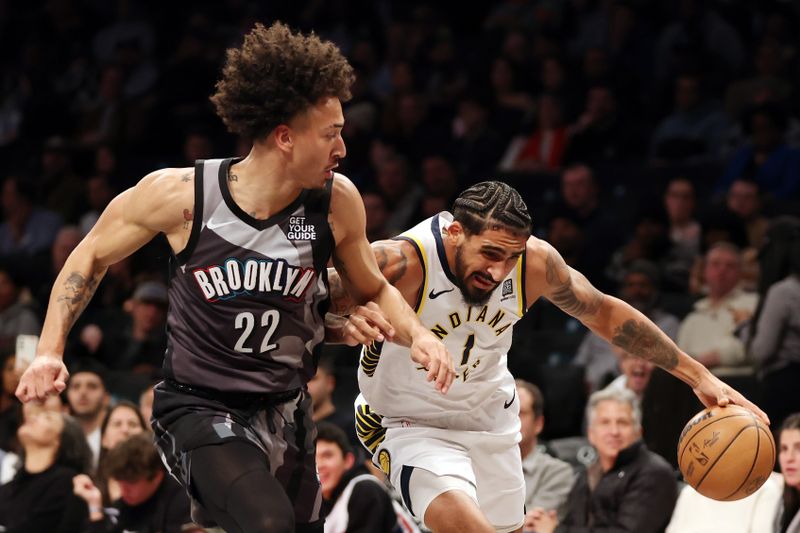 NEW YORK, NEW YORK - DECEMBER 04: Obi Toppin #1 of the Indiana Pacers dribbles against Jalen Wilson #22 of the Brooklyn Nets during the first half at Barclays Center on December 04, 2024 in the Brooklyn borough of New York City. NOTE TO USER: User expressly acknowledges and agrees that, by downloading and or using this photograph, User is consenting to the terms and conditions of the Getty Images License Agreement. (Photo by Sarah Stier/Getty Images)