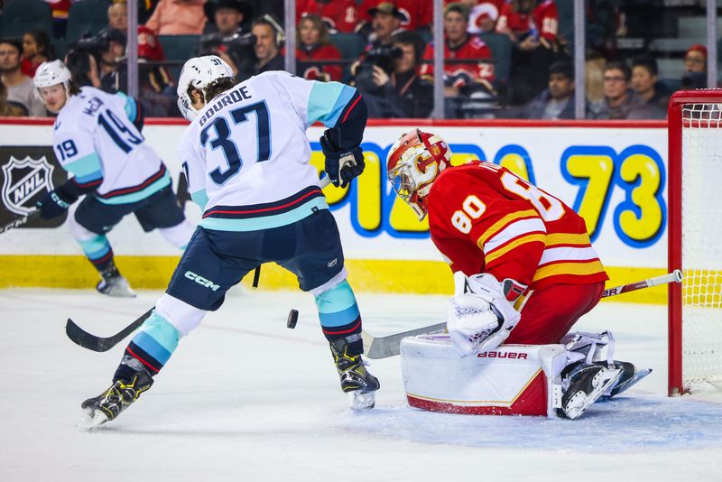 Nov 1, 2022; Calgary, Alberta, CAN; Calgary Flames goaltender Dan Vladar (80) makes a save against Seattle Kraken center Yanni Gourde (37) during the second period at Scotiabank Saddledome. Mandatory Credit: Sergei Belski-USA TODAY Sports