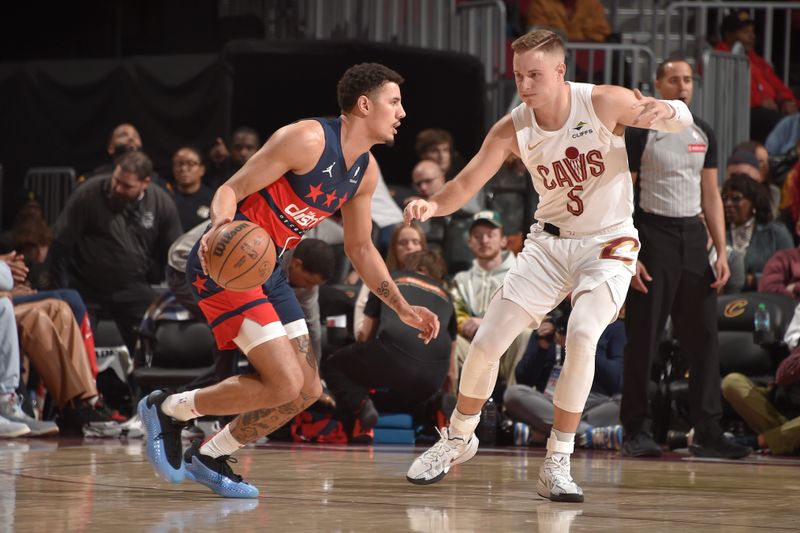 CLEVELAND, OH - DECEMBER 13: Sam Merrill #5 of the Cleveland Cavaliers plays defense during the game against the Washington Wizards on December 13, 2024 at Rocket Mortgage FieldHouse in Cleveland, Ohio. NOTE TO USER: User expressly acknowledges and agrees that, by downloading and/or using this Photograph, user is consenting to the terms and conditions of the Getty Images License Agreement. Mandatory Copyright Notice: Copyright 2024 NBAE (Photo by David Liam Kyle/NBAE via Getty Images)