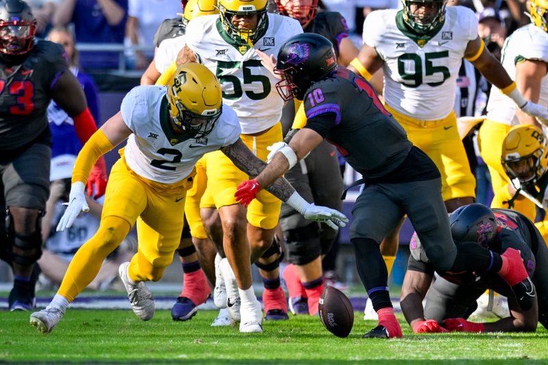 Nov 18, 2023; Fort Worth, Texas, USA; Baylor Bears linebacker Matt Jones (2) and TCU Horned Frogs quarterback Josh Hoover (10) battle for control of a fumble during the first half at Amon G. Carter Stadium. Mandatory Credit: Jerome Miron-USA TODAY Sports