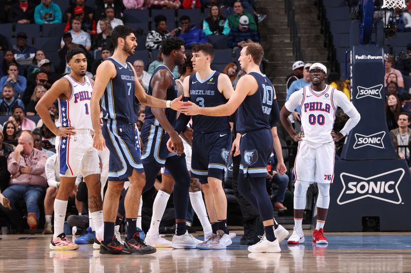 MEMPHIS, TN - NOVEMBER 22: Santi Aldama #7 and Luke Kennard #10 of the Memphis Grizzlies high five during the game against the Philadelphia 76ers on November 22, 2024 at FedExForum in Memphis, Tennessee. NOTE TO USER: User expressly acknowledges and agrees that, by downloading and or using this photograph, User is consenting to the terms and conditions of the Getty Images License Agreement. Mandatory Copyright Notice: Copyright 2024 NBAE (Photo by Joe Murphy/NBAE via Getty Images)