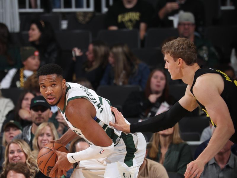 MILWAUKEE, WI - NOVEMBER 7: Giannis Antetokounmpo #34 of the Milwaukee Bucks handles the ball during the game against the Utah Jazz on November 7, 2024 at Fiserv Forum Center in Milwaukee, Wisconsin. NOTE TO USER: User expressly acknowledges and agrees that, by downloading and or using this Photograph, user is consenting to the terms and conditions of the Getty Images License Agreement. Mandatory Copyright Notice: Copyright 2024 NBAE (Photo by Gary Dineen/NBAE via Getty Images).