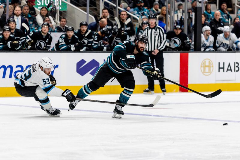Nov 18, 2025; San Jose, California, USA; San Jose Sharks defenseman Nick Leddy (4) passes the puck during the second period against the Utah Mammoth at SAP Center at San Jose. Mandatory Credit: Bob Kupbens-Imagn Images