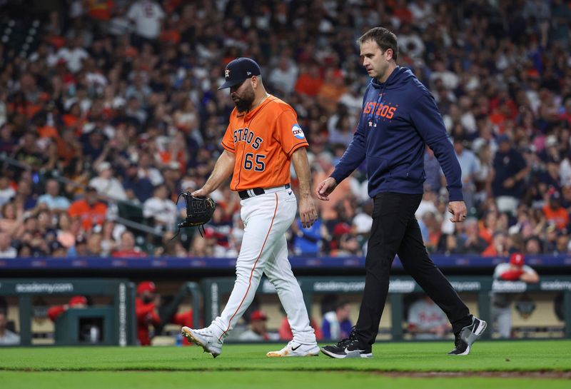 Apr 30, 2023; Houston, Texas, USA; Houston Astros starting pitcher Jose Urquidy (65) walks off the field after an apparent injury during the sixth inning against the Philadelphia Phillies at Minute Maid Park. Mandatory Credit: Troy Taormina-USA TODAY Sports