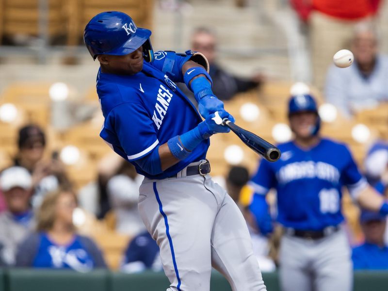 Mar 22, 2023; Phoenix, Arizona, USA; Kansas City Royals outfielder Dairon Blanco hits a home run against the Chicago White Sox during a spring training game at Camelback Ranch-Glendale. Mandatory Credit: Mark J. Rebilas-USA TODAY Sports