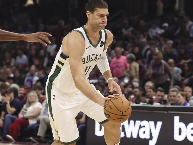 CLEVELAND, OH - NOVEMBER 4:  Brook Lopez #11 of the Milwaukee Bucks drives to the basket during the game against the Cleveland Cavaliers on November 4, 2024 at Rocket Mortgage FieldHouse in Cleveland, Ohio. NOTE TO USER: User expressly acknowledges and agrees that, by downloading and/or using this Photograph, user is consenting to the terms and conditions of the Getty Images License Agreement. Mandatory Copyright Notice: Copyright 2024 NBAE (Photo by  Lauren Leigh Bacho/NBAE via Getty Images)