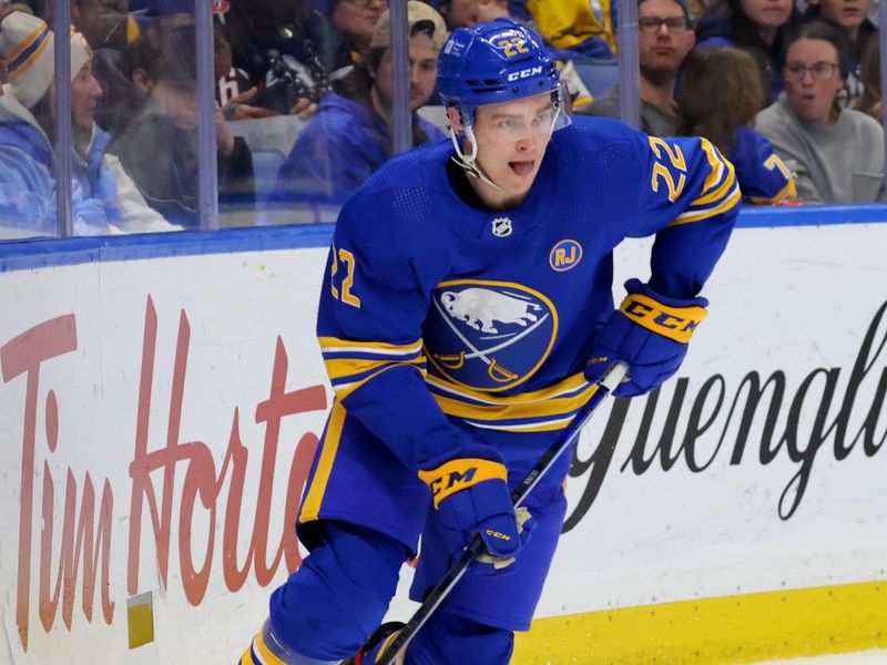 Dec 30, 2023; Buffalo, New York, USA;  Buffalo Sabres right wing Jack Quinn (22) skates with the puck during the second period against the Columbus Blue Jackets at KeyBank Center. Mandatory Credit: Timothy T. Ludwig-USA TODAY Sports