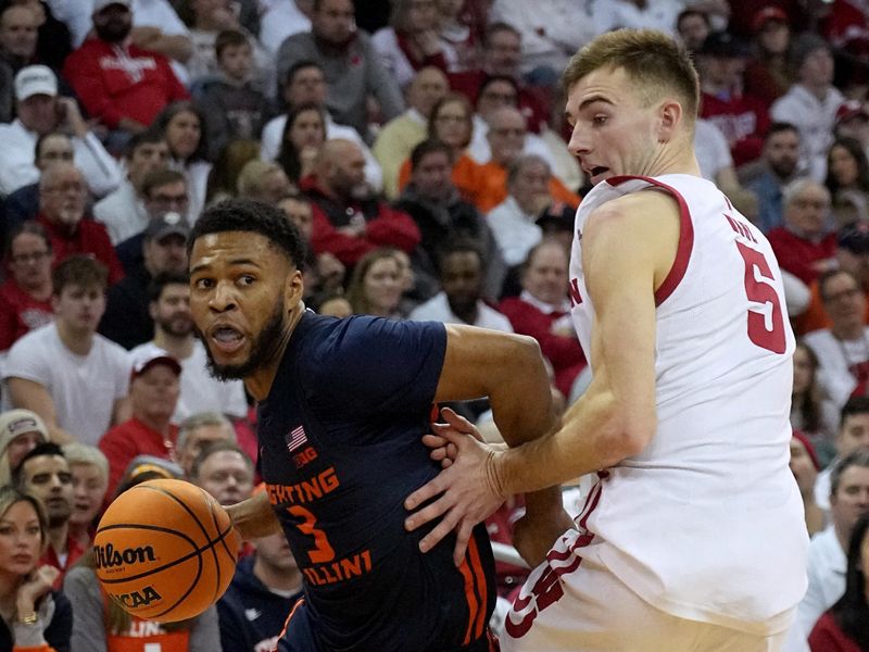 Jan 1, 2023; Madison, Wis, USA; Illinois guard Jayden Epps (3) is fouled by Wisconsin forward Tyler Wahl (5) during the first half of their game at the Kohl Center. Mandatory Credit: Mark Hoffman/Milwaukee Journal Sentinel via USA TODAY NETWORK