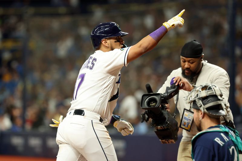 Sep 8, 2023; St. Petersburg, Florida, USA; Tampa Bay Rays third baseman Isaac Paredes (17) celebrates after he hit a home run against the Seattle Mariners during the eighth inning  at Tropicana Field. Mandatory Credit: Kim Klement Neitzel-USA TODAY Sports