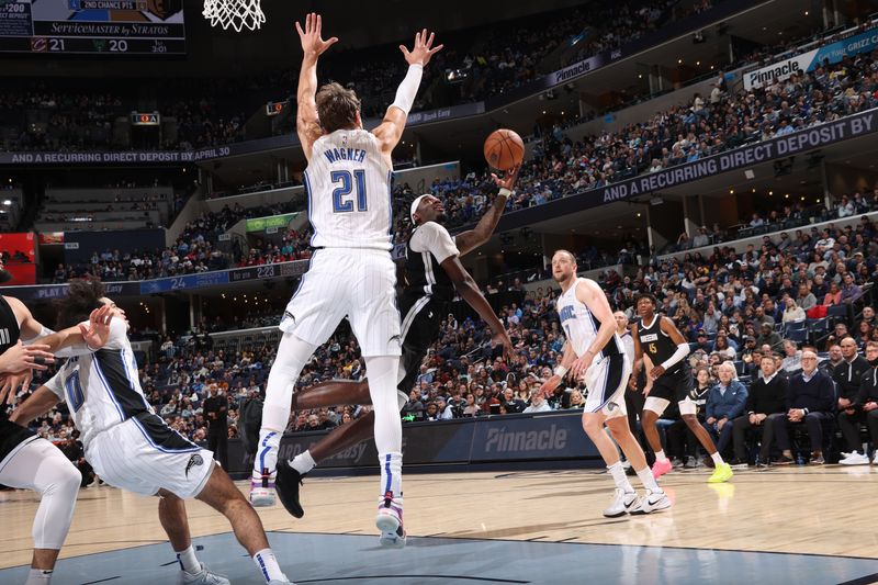 MEMPHIS, TN - JANUARY 26:  Vince Williams Jr. #5 of the Memphis Grizzlies drives to the basket during the game against the Orlando Magic on January 26, 2024 at FedExForum in Memphis, Tennessee. NOTE TO USER: User expressly acknowledges and agrees that, by downloading and or using this photograph, User is consenting to the terms and conditions of the Getty Images License Agreement. Mandatory Copyright Notice: Copyright 2024 NBAE (Photo by Joe Murphy/NBAE via Getty Images)