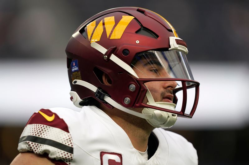 Washington Commanders quarterback Sam Howell warms up before an NFL football game against the Los Angeles Rams Sunday, Dec. 17, 2023, in Los Angeles. (AP Photo/Ryan Sun)