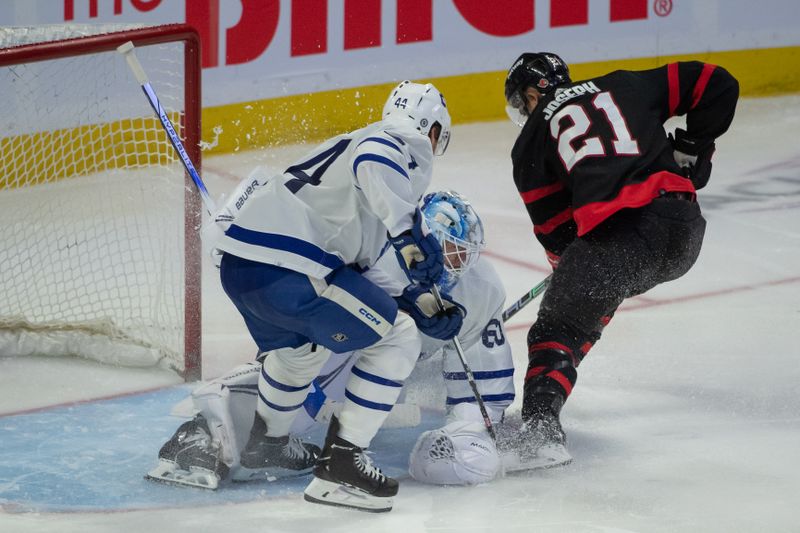 Dec 7, 2023; Ottawa, Ontario, CAN; Toronto Maple Leafs goalie Joseph Woll (60) makes a save in front of Ottawa Senators right wing Mathieu Joseph (21) in the third period at the Canadian Tire Centre. Mandatory Credit: Marc DesRosiers-USA TODAY Sports