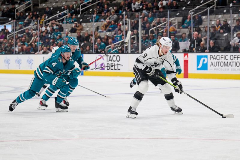 Apr 4, 2024; San Jose, California, USA; Los Angeles Kings right wing Adrian Kempe (9) skates in on a breakaway against San Jose Sharks defenseman Kyle Burroughs (4) during the first period at SAP Center at San Jose. Mandatory Credit: Robert Edwards-USA TODAY Sports