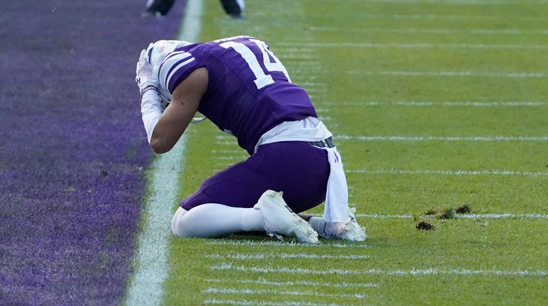 Nov 4, 2023; Chicago, Illinois, USA; Northwestern Wildcats wide receiver Cam Johnson (14) after missing a pass agains the Iowa Hawkeyes during the first half at Wrigley Field. Mandatory Credit: David Banks-USA TODAY Sports