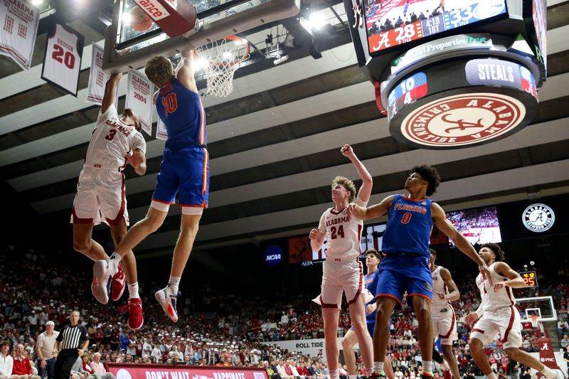 Feb 21, 2024; Tuscaloosa, Alabama, USA;  Alabama Crimson Tide guard Rylan Griffen (3) tries to block a shot against Florida Gators forward Thomas Haugh (10) at Coleman Coliseum. Mandatory Credit: Gary Cosby Jr.-USA TODAY Sports