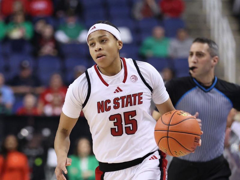 Mar 7, 2025; Greensboro, NC, USA;  NC State Wolfpack guard Zoe Brooks (35) moves the ball down court against Georgia Tech Yellow Jackets during the third quarter at First Horizon Coliseum. Mandatory Credit: Cory Knowlton-Imagn Images
