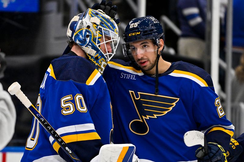 Jan 11, 2024; St. Louis, Missouri, USA;  St. Louis Blues center Jordan Kyrou (25) and goaltender Jordan Binnington (50) celebrate after the Blues defeated the New York Rangers at Enterprise Center. Mandatory Credit: Jeff Curry-USA TODAY Sports