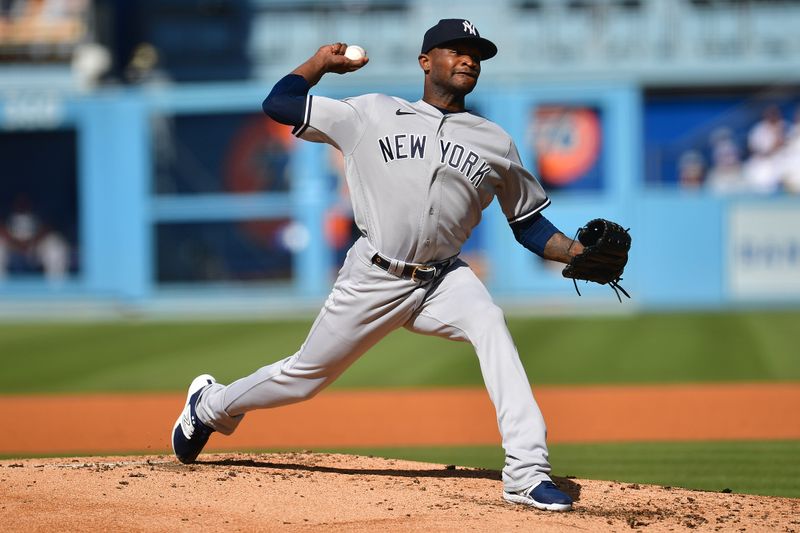 Jun 4, 2023; Los Angeles, California, USA; New York Yankees starting pitcher Domingo German (0) throws against the Los Angeles Dodgers during the second inning at Dodger Stadium. Mandatory Credit: Gary A. Vasquez-USA TODAY Sports