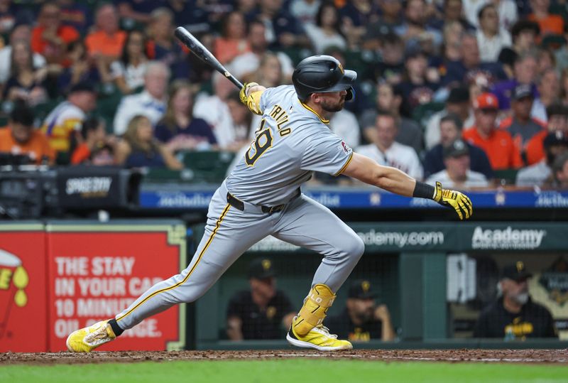 Jul 30, 2024; Houston, Texas, USA; Pittsburgh Pirates second baseman Jared Triolo (19) hits an RBI double during the fourth inning against the Houston Astros at Minute Maid Park. Mandatory Credit: Troy Taormina-USA TODAY Sports
