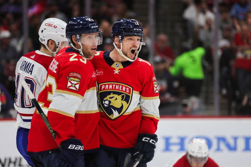 Feb 29, 2024; Sunrise, Florida, USA; Florida Panthers center Sam Reinhart (13) celebrates with center Carter Verhaeghe (23) after scoring against the Montreal Canadiens during the second period at Amerant Bank Arena. Mandatory Credit: Sam Navarro-USA TODAY Sports