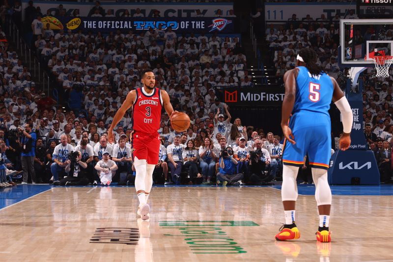 OKLAHOMA CITY, OK - APRIL 24: CJ McCollum #3 of the New Orleans Pelicans dribbles the ball during the game against the Oklahoma City Thunder during Round 1 Game 2 of the 2024 NBA Playoffs on April 24, 2024 at Paycom Arena in Oklahoma City, Oklahoma. NOTE TO USER: User expressly acknowledges and agrees that, by downloading and or using this photograph, User is consenting to the terms and conditions of the Getty Images License Agreement. Mandatory Copyright Notice: Copyright 2024 NBAE (Photo by Zach Beeker/NBAE via Getty Images)