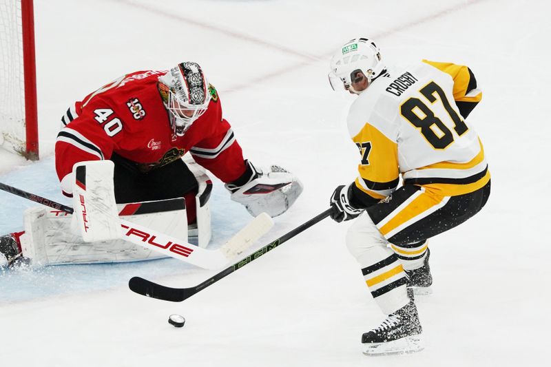Dec 28, 2025; Chicago, Illinois, USA; Pittsburgh Penguins center Sidney Crosby (87) skates in on Chicago Blackhawks goaltender Arvid Soderblom (40) during the second period at United Center. Mandatory Credit: David Banks-Imagn Images