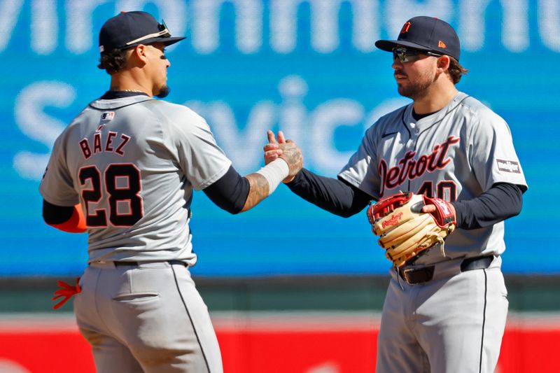 Apr 21, 2024; Minneapolis, Minnesota, USA; Detroit Tigers shortstop Javier Baez (28) and second baseman Buddy Kennedy (40) celebrate the win over the Minnesota Twins at Target Field. Mandatory Credit: Bruce Kluckhohn-USA TODAY Sports