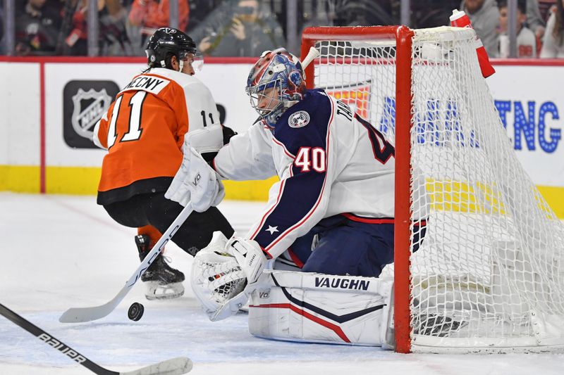 Jan 4, 2024; Philadelphia, Pennsylvania, USA; Columbus Blue Jackets goaltender Daniil Tarasov (40) makes a save against Philadelphia Flyers right wing Travis Konecny (11) during the first period at Wells Fargo Center. Mandatory Credit: Eric Hartline-USA TODAY Sports