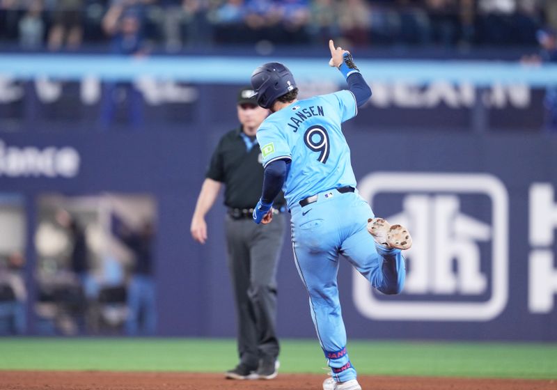 May 11, 2024; Toronto, Ontario, CAN; Toronto Blue Jays catcher Danny Jansen (9) runs the bases and celebrates after hitting a two run home run against the Minnesota Twins during the fifth inning at Rogers Centre. Mandatory Credit: Nick Turchiaro-USA TODAY Sports