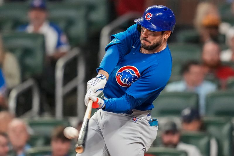 Sep 27, 2023; Cumberland, Georgia, USA; Chicago Cubs center fielder Mike Tauchman (40) hits a home run against the Atlanta Braves during the third inning at Truist Park. Mandatory Credit: Dale Zanine-USA TODAY Sports