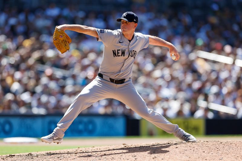 May 26, 2024; San Diego, California, USA;  New York Yankees relief pitcher Caleb Ferguson (64) throws a pitch in the seventh inning against the San Diego Padres at Petco Park. Mandatory Credit: David Frerker-USA TODAY Sports