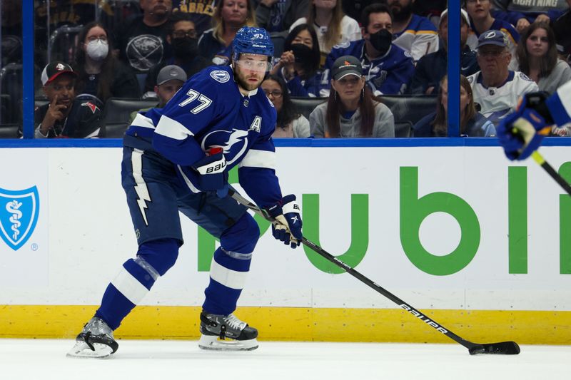 Feb 29, 2024; Tampa, Florida, USA;  Tampa Bay Lightning defenseman Victor Hedman (77) controls the puck against the Buffalo Sabres in the first period at Amalie Arena. Mandatory Credit: Nathan Ray Seebeck-USA TODAY Sports