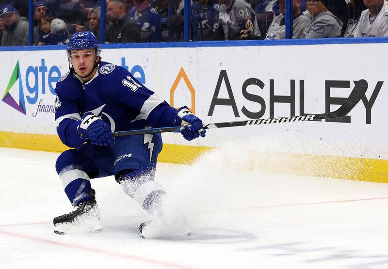 Dec 19, 2023; Tampa, Florida, USA; Tampa Bay Lightning center Luke Glendening (11) skates against the St. Louis Blues during the first period at Amalie Arena. Mandatory Credit: Kim Klement Neitzel-USA TODAY Sports