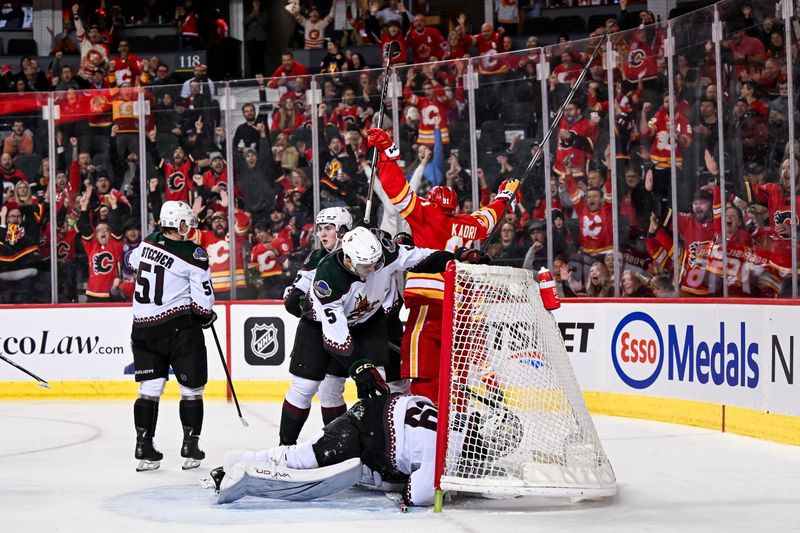 Jan 16, 2024; Calgary, Alberta, CAN; Calgary Flames center Nazem Kadri (91) celebrates after scoring a goal against Arizona Coyotes goaltender Connor Ingram (39) during the third period at Scotiabank Saddledome. Mandatory Credit: Brett Holmes-USA TODAY Sports