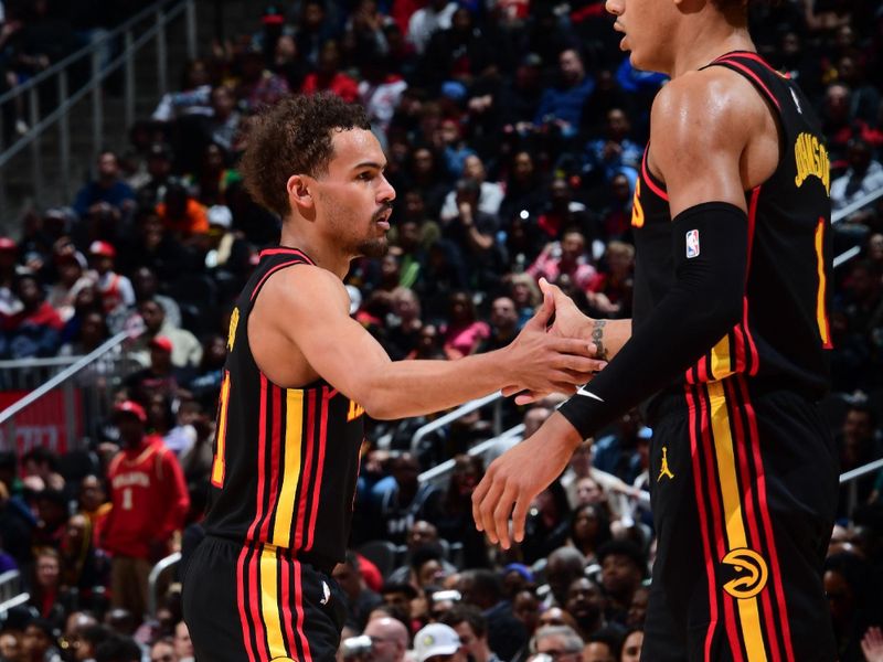 ATLANTA, GA - February 23:   Trae Young #11 of the Atlanta Hawks reacts during the game against the Toronto Raptors on February 23, 2024 at State Farm Arena in Atlanta, Georgia.  NOTE TO USER: User expressly acknowledges and agrees that, by downloading and/or using this Photograph, user is consenting to the terms and conditions of the Getty Images License Agreement. Mandatory Copyright Notice: Copyright 2024 NBAE (Photo by Scott Cunningham/NBAE via Getty Images)