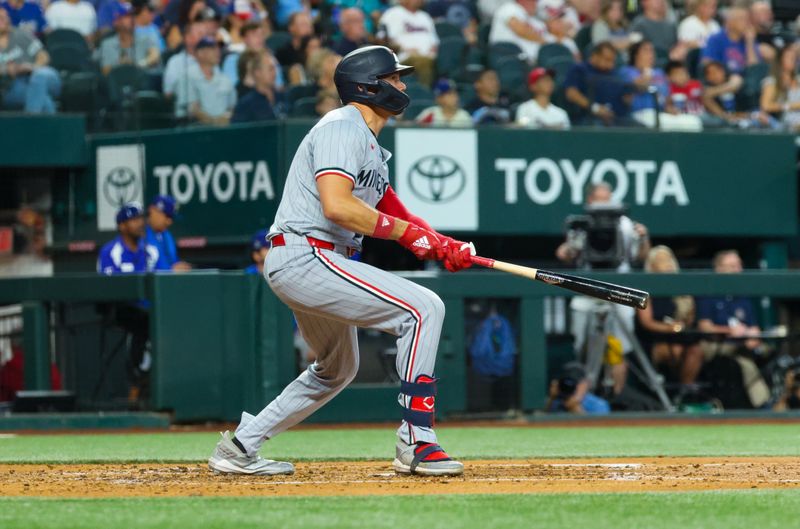 Aug 17, 2024; Arlington, Texas, USA;  Minnesota Twins left fielder Trevor Larnach (9) hits a home run during the fourth inning against the Texas Rangers at Globe Life Field. Mandatory Credit: Kevin Jairaj-USA TODAY Sports