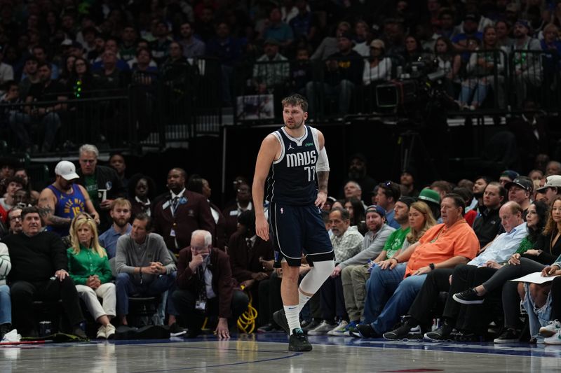 DALLAS, TX - MARCH 17: Luka Doncic #77 of the Dallas Mavericks looks on during the game against the Denver Nuggets on March 17, 2024 at the American Airlines Center in Dallas, Texas. NOTE TO USER: User expressly acknowledges and agrees that, by downloading and or using this photograph, User is consenting to the terms and conditions of the Getty Images License Agreement. Mandatory Copyright Notice: Copyright 2024 NBAE (Photo by Glenn James/NBAE via Getty Images)