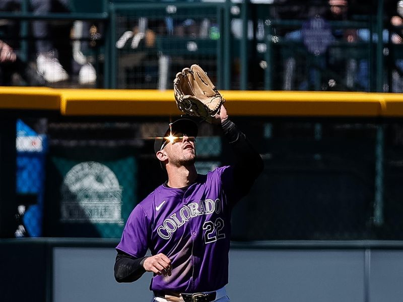 Apr 7, 2024; Denver, Colorado, USA; Colorado Rockies left fielder Nolan Jones (22) makes a catch for an out in the sixth inning against the Tampa Bay Rays at Coors Field. Mandatory Credit: Isaiah J. Downing-USA TODAY Sports